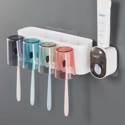 toothpaste and brush with cups